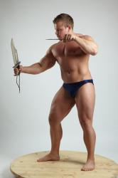 Man Adult Muscular White Fighting with knife Standing poses Underwear